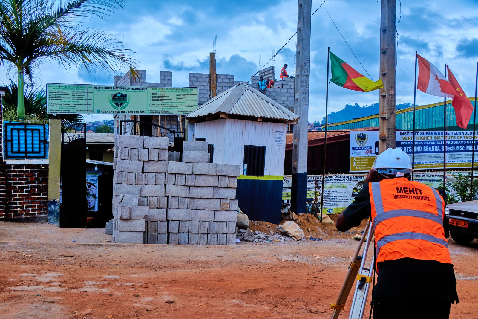 Students practicing surveying, construction materials testing and technical drawing in a civil engineering training environment